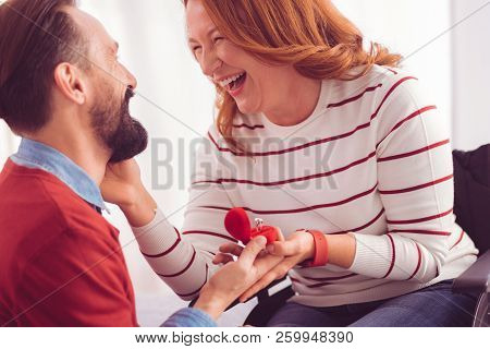Cheerful Disabled Woman Holding An Engagement Ring