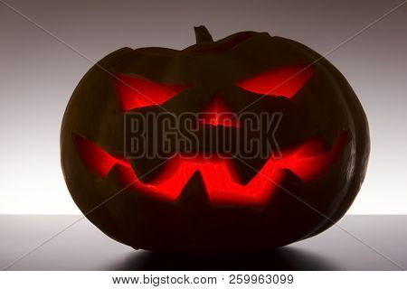 Scary Halloween Pumpkin On A White Background