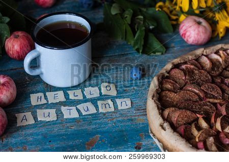 Apple Pie On Wooden Blue Rustic Background. Hello Autumn Picture. Apples, Tea In A Metal Countre Cup