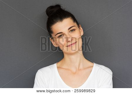 Candid Shot Of Attractive Young Brunette Caucasian Woman With Clean Skin Looking And Smiling At The 