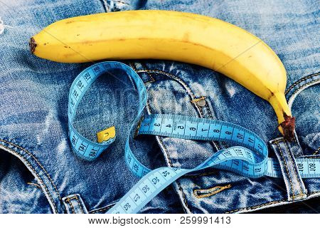 Kinky Fruit With Blue Measure Tape On Jeans, Close Up