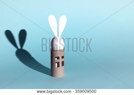 Easter Egg Bunny On Self-insulation. In The Toilet Paper Cabin. A Concept On Quarantine And Pandemic
