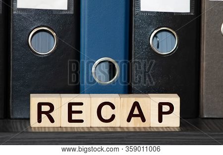 Recap Word From Wooden Blocks On Desk