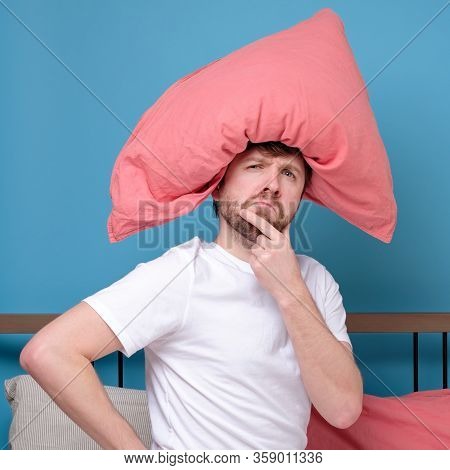 Cauacsian Young Man With Pillow On Head Lying In Bed And Screaming Being Alone Stressed Because Of Q