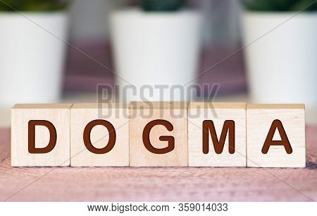 Text Of Dogma On Cubes, Word Written In Wooden Cube