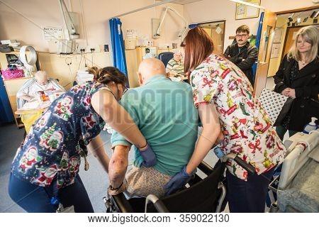 Andover,hampshire/united Kingdom- December 25 2019:an Elderly Man With Brain Injury Is Being Helped 