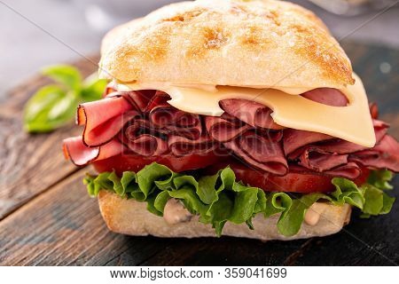 Healthy And Filling Roastbeef Sandwich With Swiss Cheese And Thousand Island Sauce