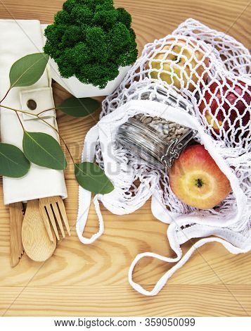 Net Bag With Reusable  Glass Jars, Fruits And Bamboo Cutlery. Zero Waste Concept. Eco Friendly. Flat