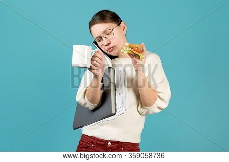 Business Girl Speaks On The Phone, Clutching His Shoulder To Her Ear, Holds Documents Under The Armp