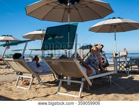 Cesenatico, Emilia Romagna, Italy - Sept 13 2019: People Are Resting On A Sunny Day At The Beach In 