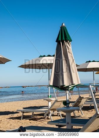Cesenatico, Emilia Romagna, Italy - Sept 13 2019: People Are Resting On A Sunny Day At The Beach In 