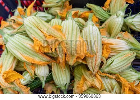 Fresh Zucchini Flowers At A Farmers Market In Italy