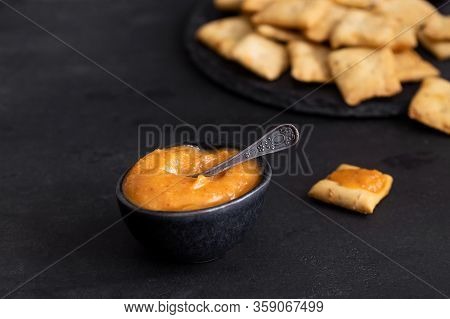 Almogrote , Cheese Paste, In Black Ceramic Bowl And Toasts. Typical La Gomera Appetizer In Many Rest