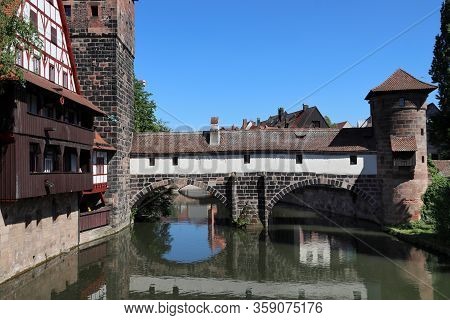 Nuremberg City, Germany - Wasserturm Medieval Tower, Henkersteg Bridge And Henkerhaus.