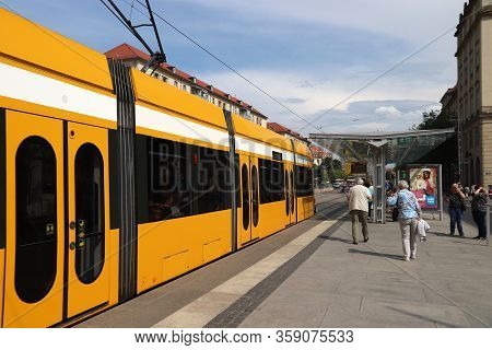 Dresden, Germany - May 10, 2018: Passengers Ride On Public Transportation Electric Tram In Dresden. 
