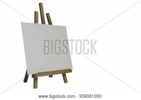 Small Table Top Wooden Easel And Blank Canvas Isolated On White Background. The Workplace Of The Art