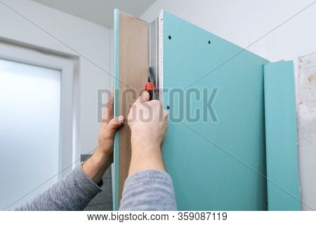 Drywall Bulkhead Construction In Domestic Bathroom. Cutting Gypsum Sheet