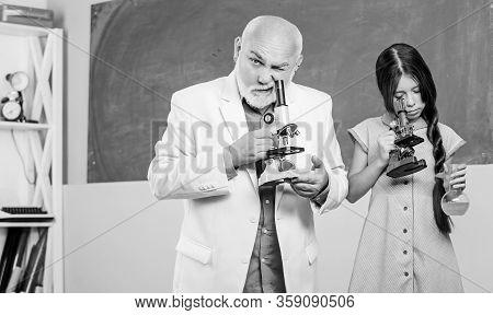 Chemistry And Biology. Little Girl With Man Tutor Study Science. Experienced Pedagogue. Teacher Help
