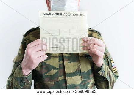 Police Officer With Handcuffs In Khaki Colored Uniform Stops People On The Street For Violating Rule