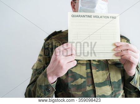 Police Officer With Handcuffs In Khaki Colored Uniform Stops People On The Street For Violating Rule