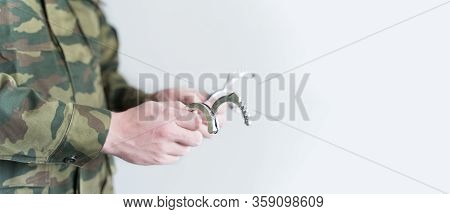 Police Officer With Handcuffs In Khaki Colored Uniform Stops And Arrest Criminal On The Street For V