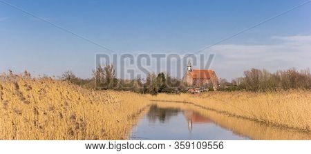 Panorama Of A Little River Leading To The Small Town Of Holwierde In Groningen, Netherlands