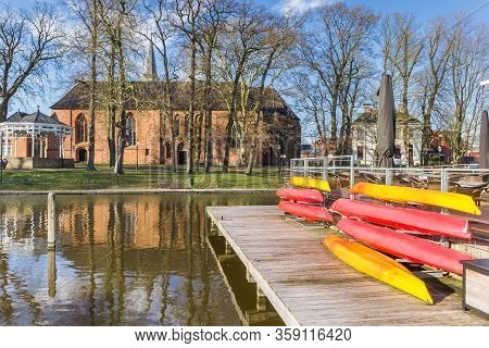 Appingedam, Netherlands - March 25, 2020: Canoes At The Jetty In The Harbor Of Appingedam, Netherlan
