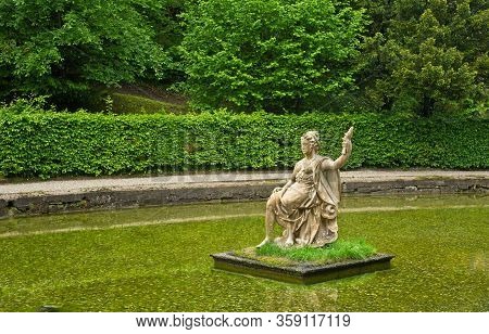 Salzburg, Austria - May 28, 2019: A Statue Of The Greek Goddess Amphitrite -- Holding Up A Fish -- S