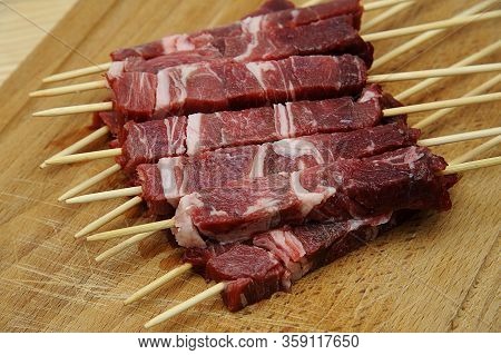 Delicious Italian Arrosticini On A Wooden Table. Abruzzo