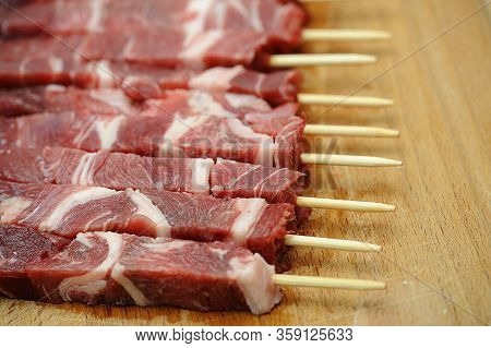 Delicious Italian Arrosticini On A Wooden Table. Abruzzo