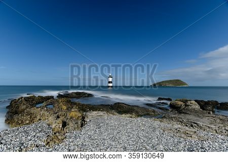 Penmon Lighthouse On Anglesey A Panoramic View