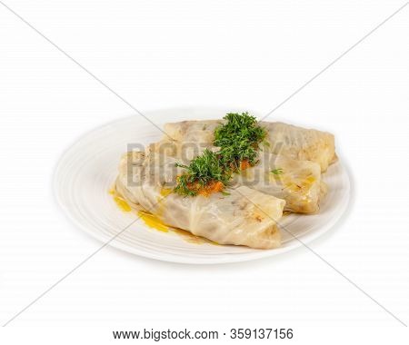A Portion Of Three Stuffed Cabbage-rolls On A Plate With Fresh Herbs. Side View, Close Up. Isolate