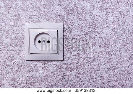 Close Up Photo Of A White 220 Volt Power Socket With Copyspace. 220 Volt European Outlet