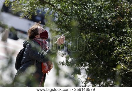 Sofia, Bulgaria - 30 March, 2020: A Woman Wearing A Multiple Use Protective Face Mask During The Cor