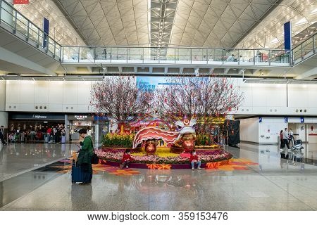 Hong Kong, China - 2020: Hong Kong International Airport From The Inside. A Flowerbed, Trees With Re