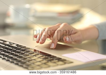 Close Up Of Woman Hand With Laptop Using Touchpad On A Desk At Home