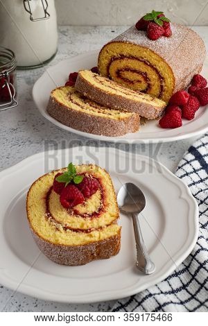 Raspberry Swiss Roll Sliced In A Plate
