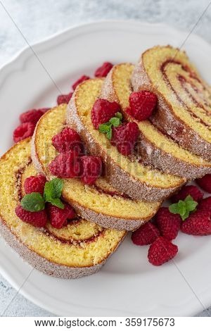Raspberry Swiss Rolls Sliced On Plate Red Color