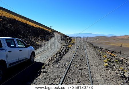 The Road And The Train Trucks Intertwined In The Pune Between Caipe And Socompa, Salta, Argentina