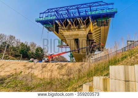 Sejong, South Korea; April 1, 2020: Section Of New Bridge Under Construction On Spring Day Under Cle