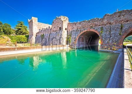 Mincio River In Italian Village Of Borghetto And Historic Bridge View, Veneto Region Of Northern Ita