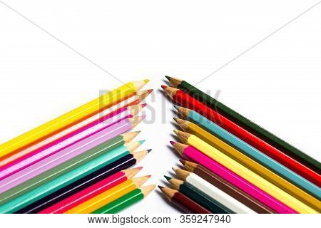 Colored Wooden Sharpened Pencils For Office And School On A White Background