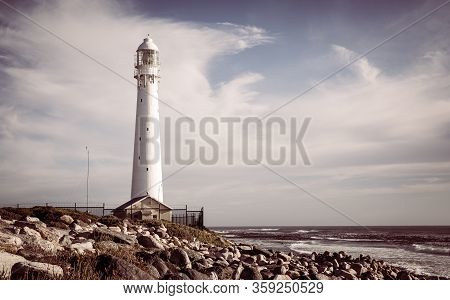 Slangkop Lighthouse Near The Town Of Kommetjie In Cape Town, South Africa