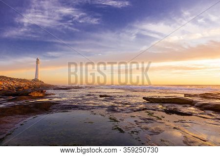 Slangkop Lighthouse Near The Town Of Kommetjie In Cape Town, South Africa