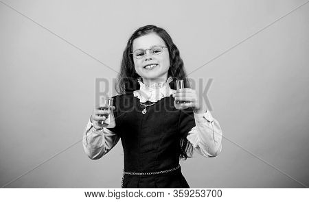 Small Girl Scientist With Testing Flask. Back To School. Education And Knowledge. Child Study Bilogy
