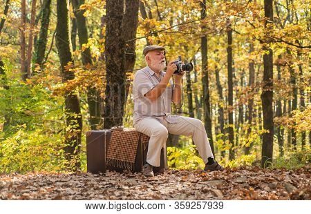 Pension Hobby. Retro Photographer. Used To Manual Settings. Old Man Shoot In Nature. Landscape And N