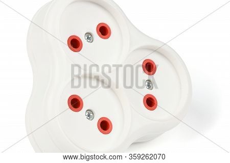 Plastic Electrical Tee Connector With Three Sockets On A White Background.