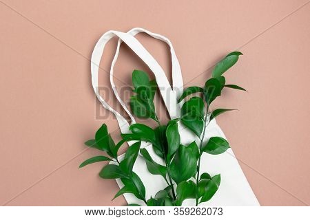 Bouquet Of Ruscus Branches And Reusable Shopping Bag. Plastic Free Concept.