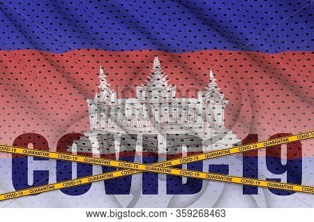 Cambodia Flag And Covid-19 Inscription With Orange Quarantine Border Tape. Coronavirus Or 2019-ncov 
