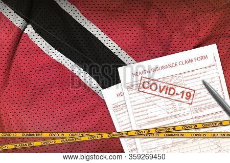 Trinidad And Tobago Flag And Health Insurance Claim Form With Covid-19 Stamp. Coronavirus Or 2019-nc